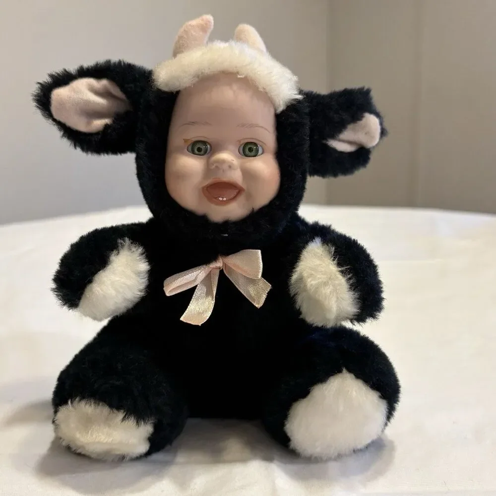 Vintage Rubber Face Baby With Cow Plush Suit